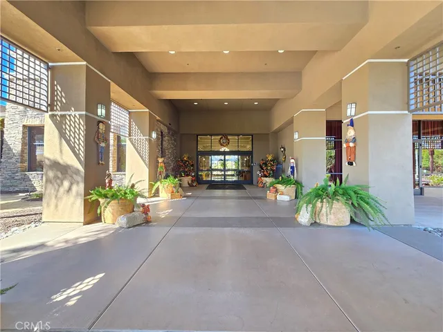 a room with lots of furniture and a book shelf