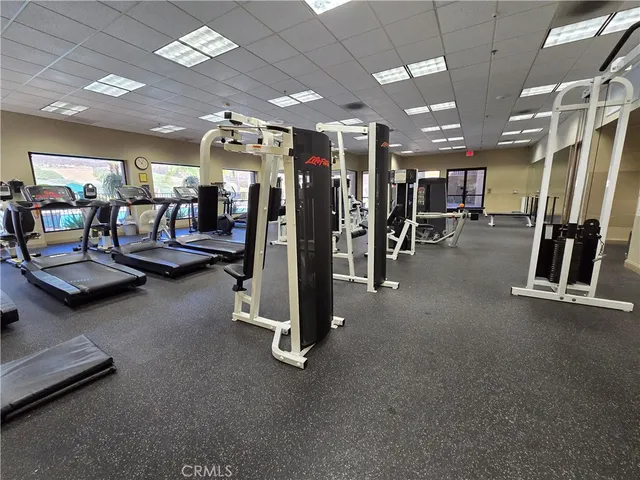 a view of a patio with table and chairs and potted plants