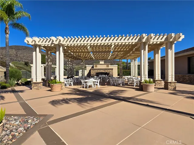 a view of a backyard tables and chairs