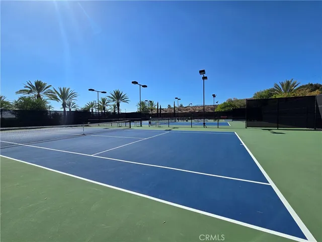 a room with pool table and windows