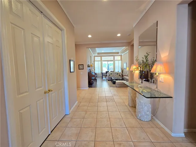 a lobby with furniture and floor to ceiling window