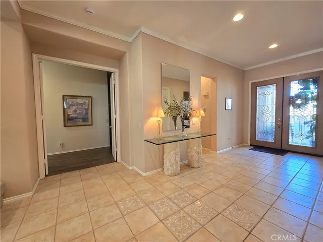 a view of a kitchen with furniture and wooden floor