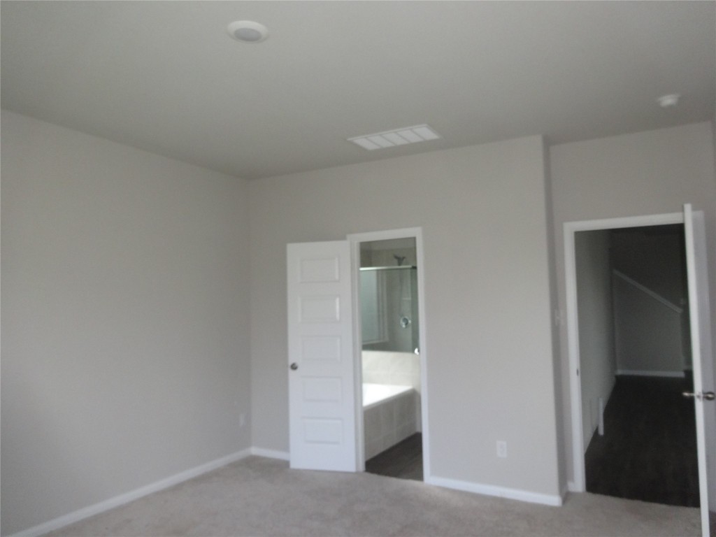 2116 Graham Pt Way Conroe, TX 77301 - Photo 4 of 13 Primary bedroom downstairs