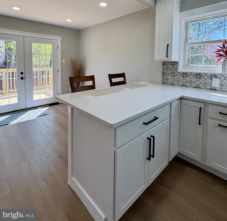 a kitchen with a sink stove and refrigerator