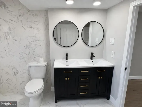 a bathroom with a bathtub sink and toilet