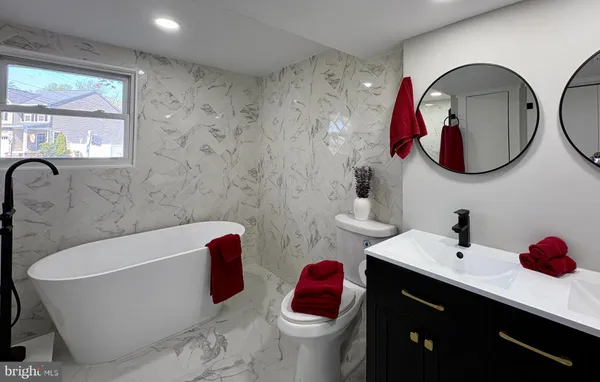 a bathroom with a tub and shower