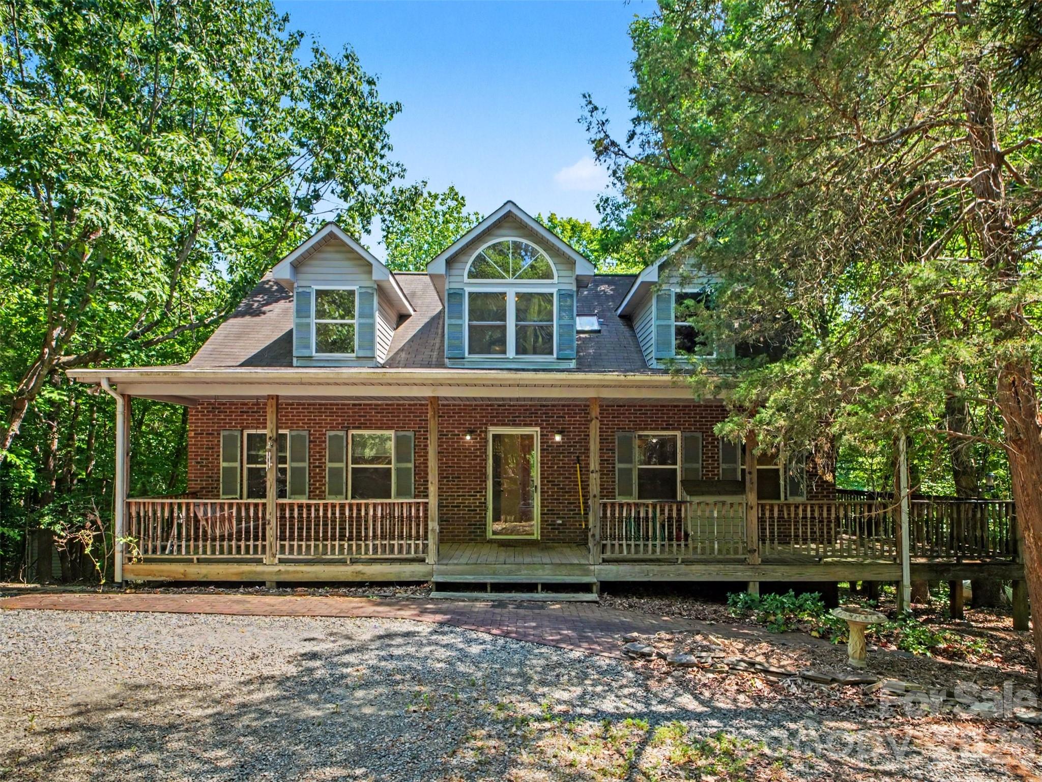 11109 Asbury Chapel Road Huntersville, NC 28078 - Photo 2 of 33 a front view of a house with a garden