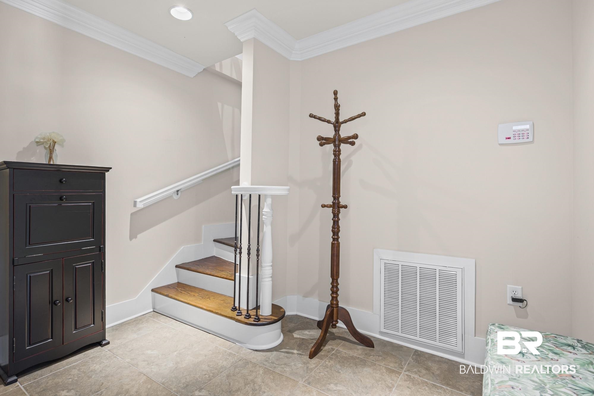 701 Dauphin Street, Unit A Mobile, AL 36602 - Photo 4 of 31 Curved staircase featuring wood treads and wrought iron balusters