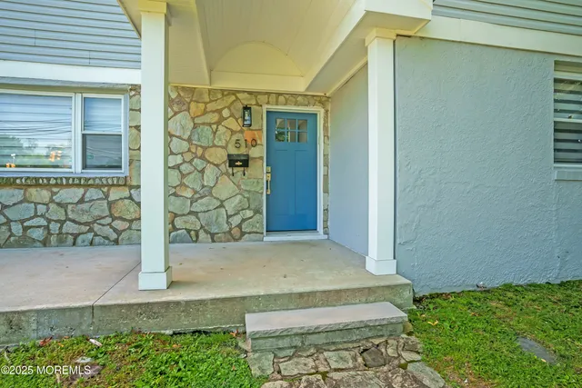 a view of green field with sitting area