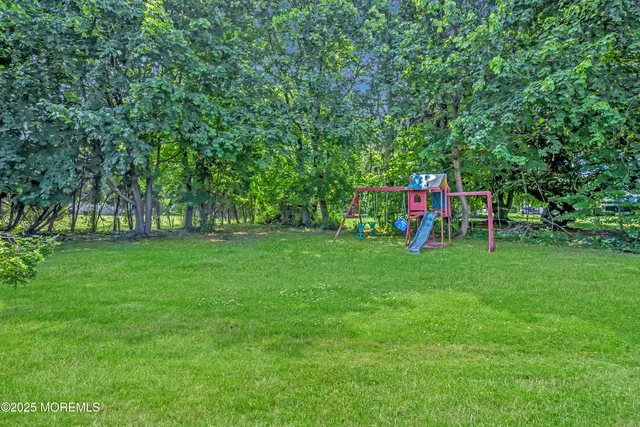 a view of green field with sitting area