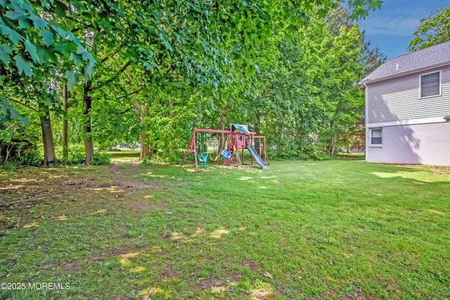 a spacious bedroom with a bed and window
