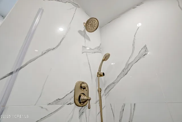 a spacious bedroom with two beds and a window