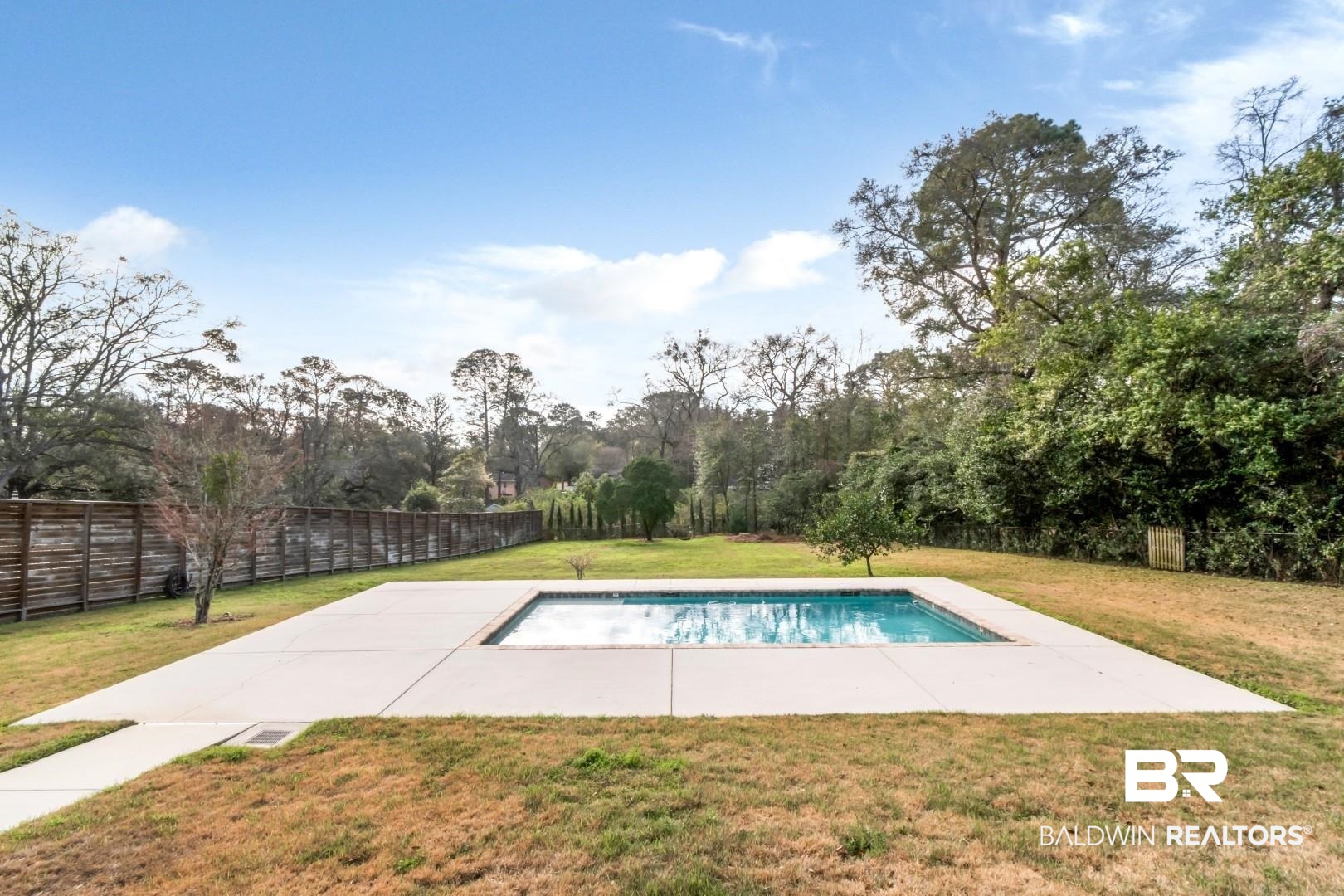 231 Rochester Road Mobile, AL 36608 - Photo 43 of 51 View of swimming pool featuring a fenced backyard and patio surround
