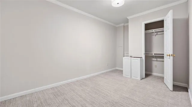 a view of empty room with closet