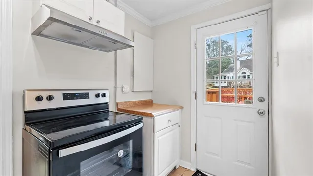 a kitchen with a stove and a microwave
