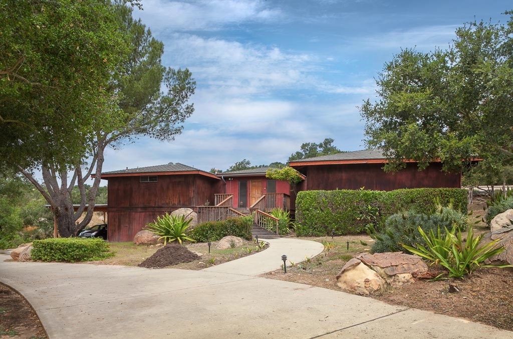 175 El Cielito Road Santa Barbara, CA 93103 - Photo 1 of 1 a view of a house with a yard and a garden