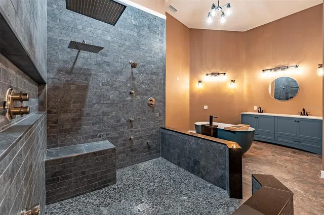 a kitchen with granite countertop cabinets and wooden floor