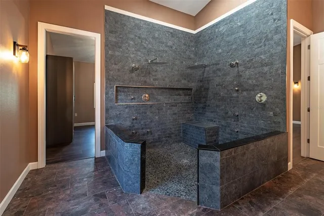 a bathroom with a bathtub and a shower