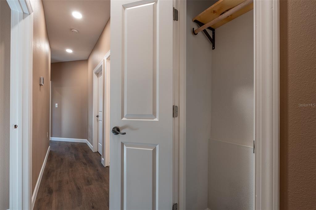 6425 Cartwrite Road Spring Hill, FL 34609 - Photo 38 of 74 a view of a hallway with wooden floor