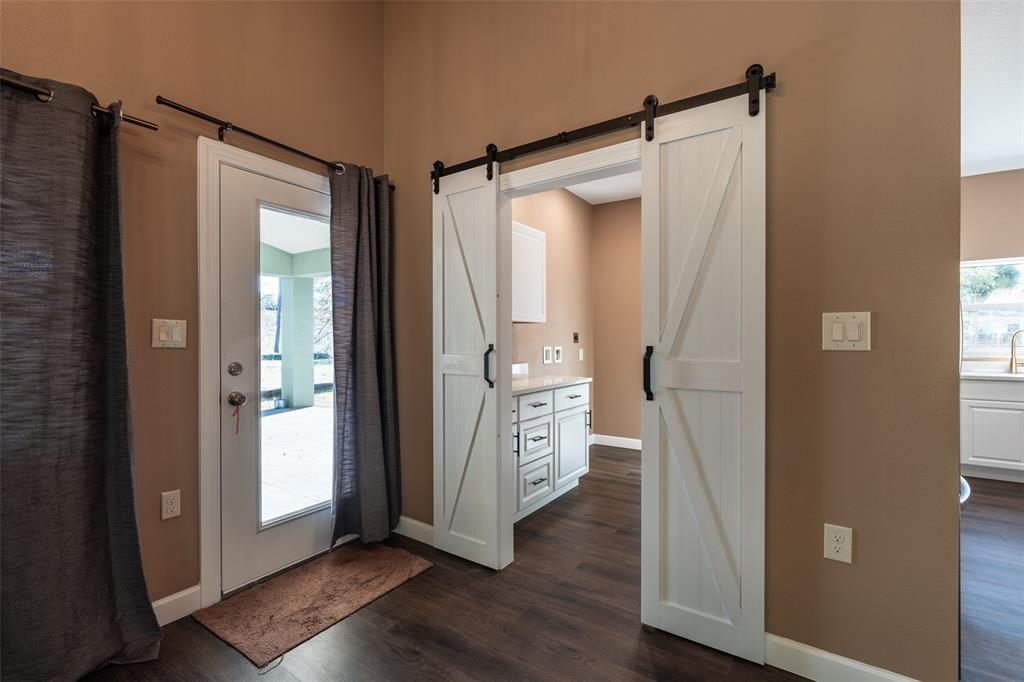 6425 Cartwrite Road Spring Hill, FL 34609 - Photo 48 of 74 a view of walk in closet and wooden floor