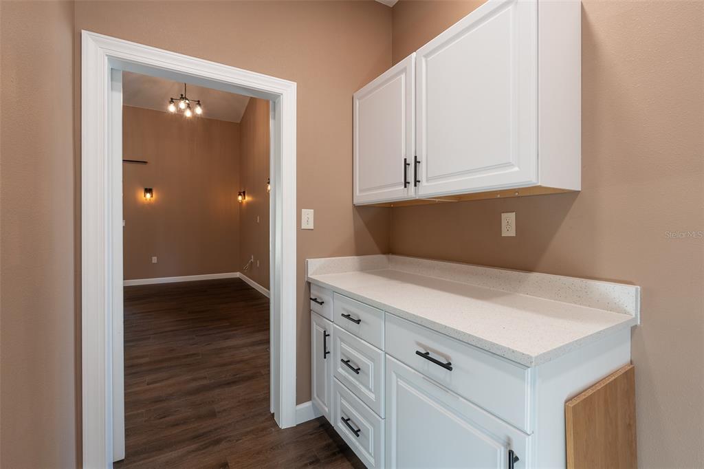 6425 Cartwrite Road Spring Hill, FL 34609 - Photo 50 of 74 a view of cabinets with wooden floor