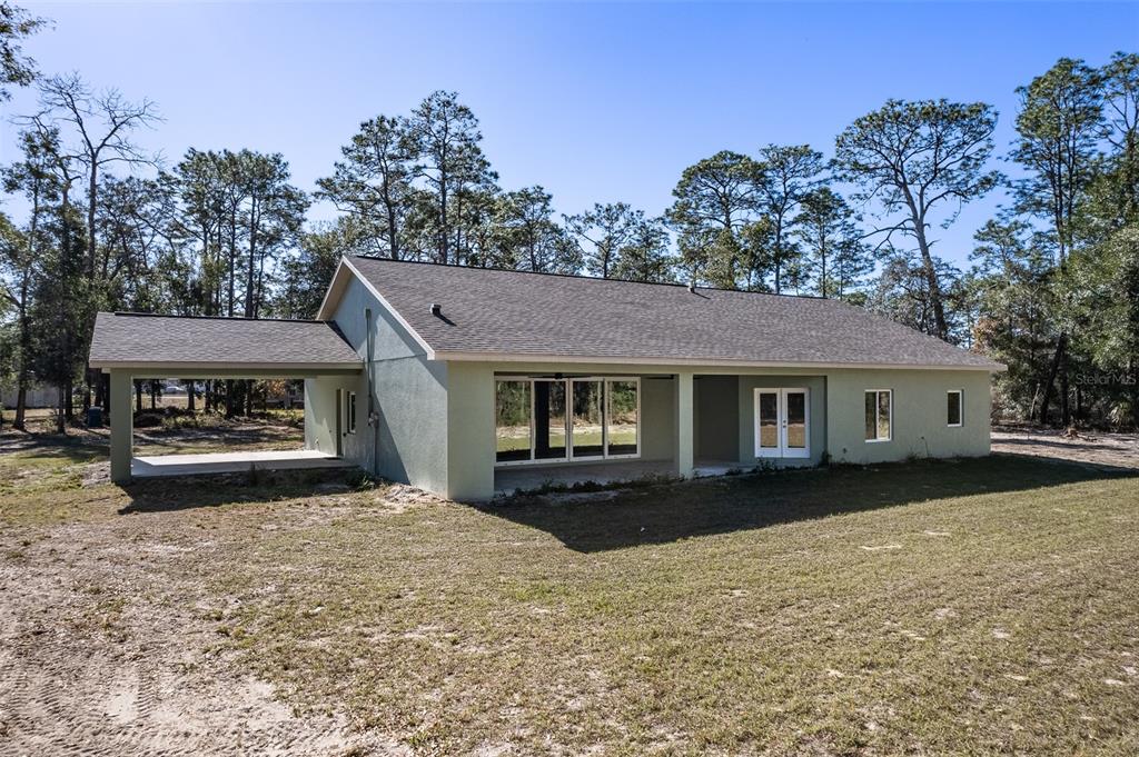 6425 Cartwrite Road Spring Hill, FL 34609 - Photo 67 of 74 a front view of a house with a yard