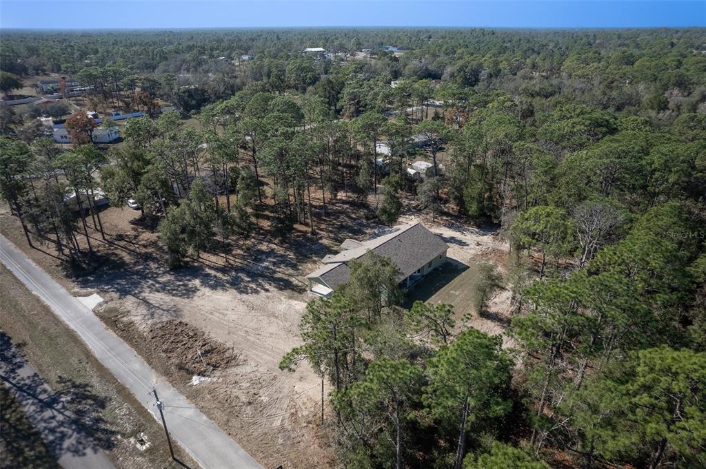 6425 Cartwrite Road Spring Hill, FL 34609 - Photo 73 of 74 an aerial view of a house with a yard