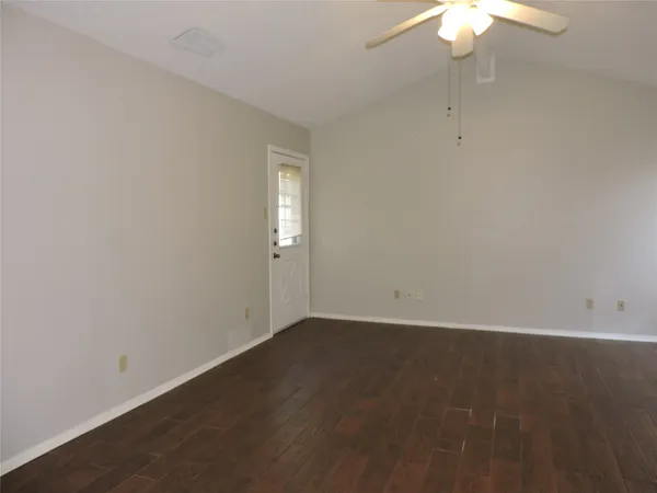 an empty room with a fan