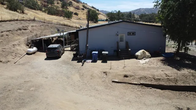 a view of a backyard of the house