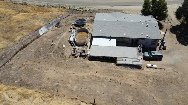 a view of a yard covered in snow