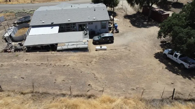 a yard with wooden fence