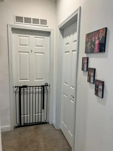 a view of a hallway with workspace