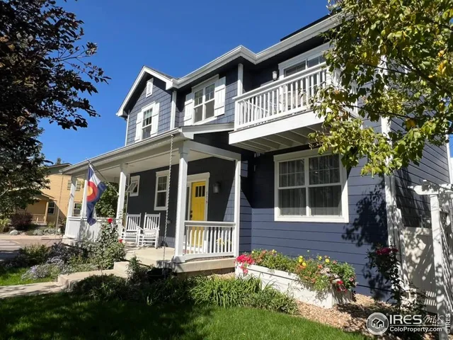 a view of a tree in front of a house