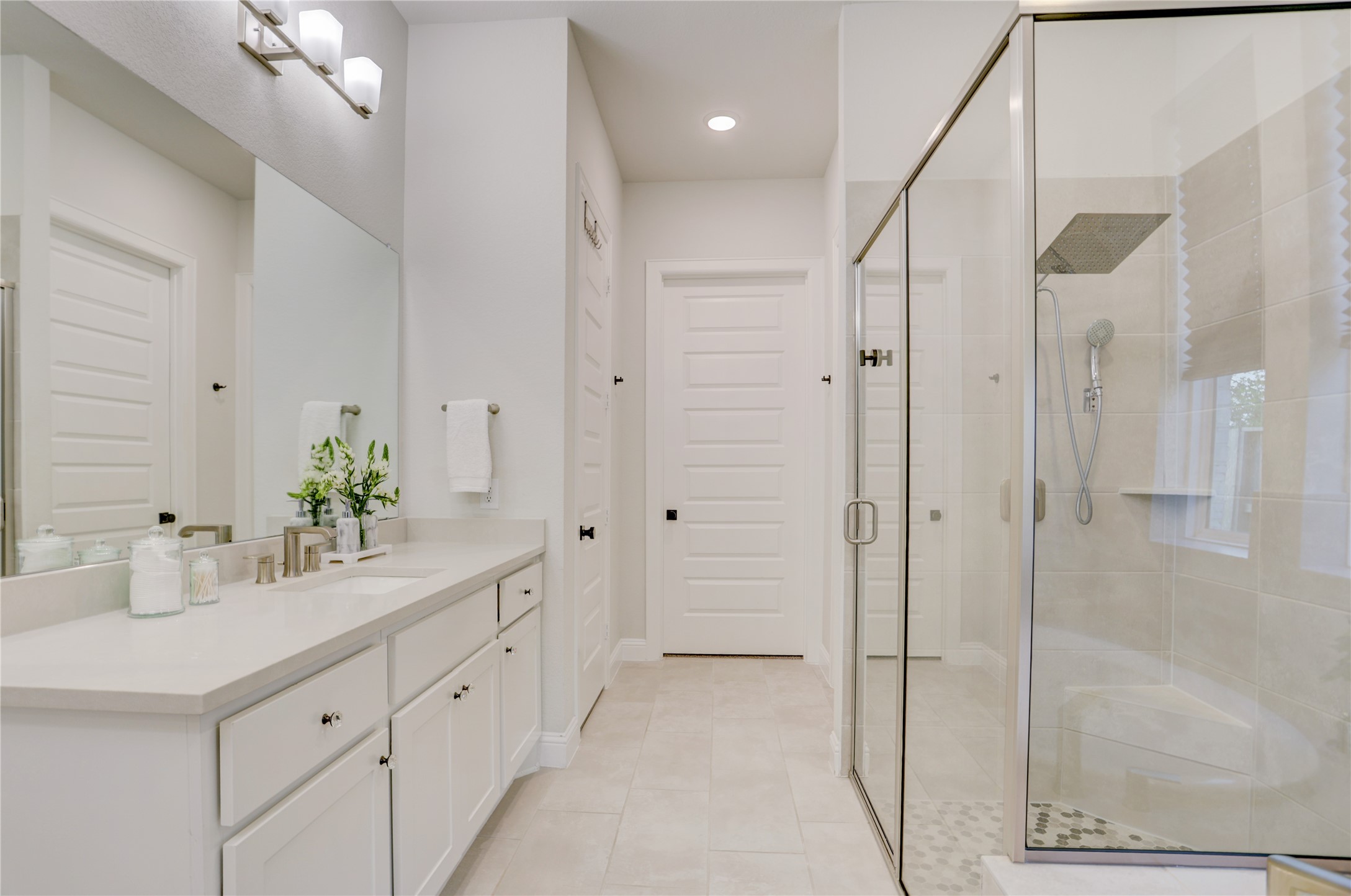 9818 Wright Drive Manvel, TX 77583 - Photo 16 of 32 a bathroom with a double vanity sink mirror and shower
