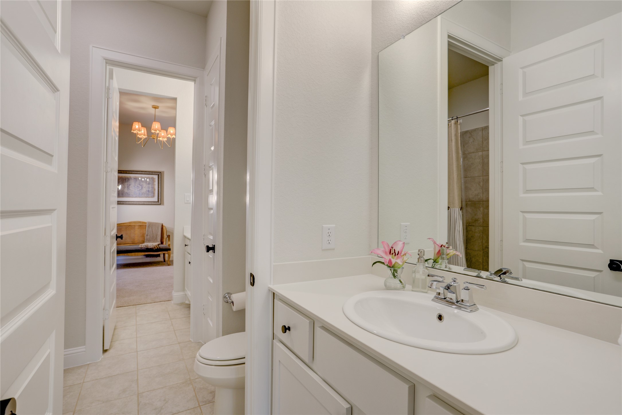 9818 Wright Drive Manvel, TX 77583 - Photo 21 of 32 a bathroom with a sink a toilet and shower