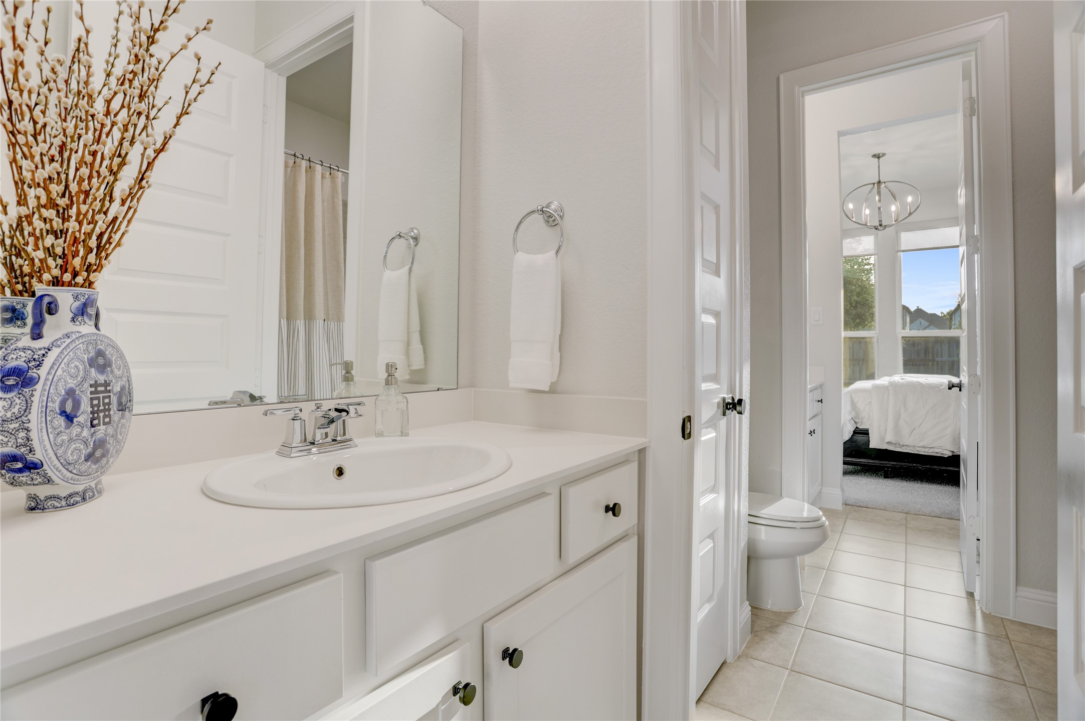9818 Wright Drive Manvel, TX 77583 - Photo 22 of 32 a bathroom with a sink and a mirror with toilet
