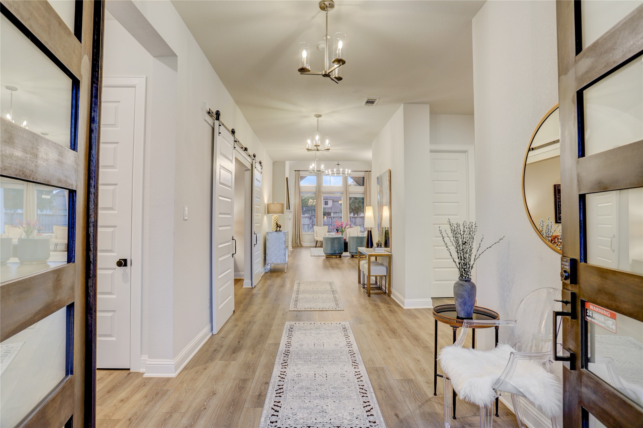 9818 Wright Drive Manvel, TX 77583 - Photo 3 of 32 a view of a hallway with wooden floor and windows