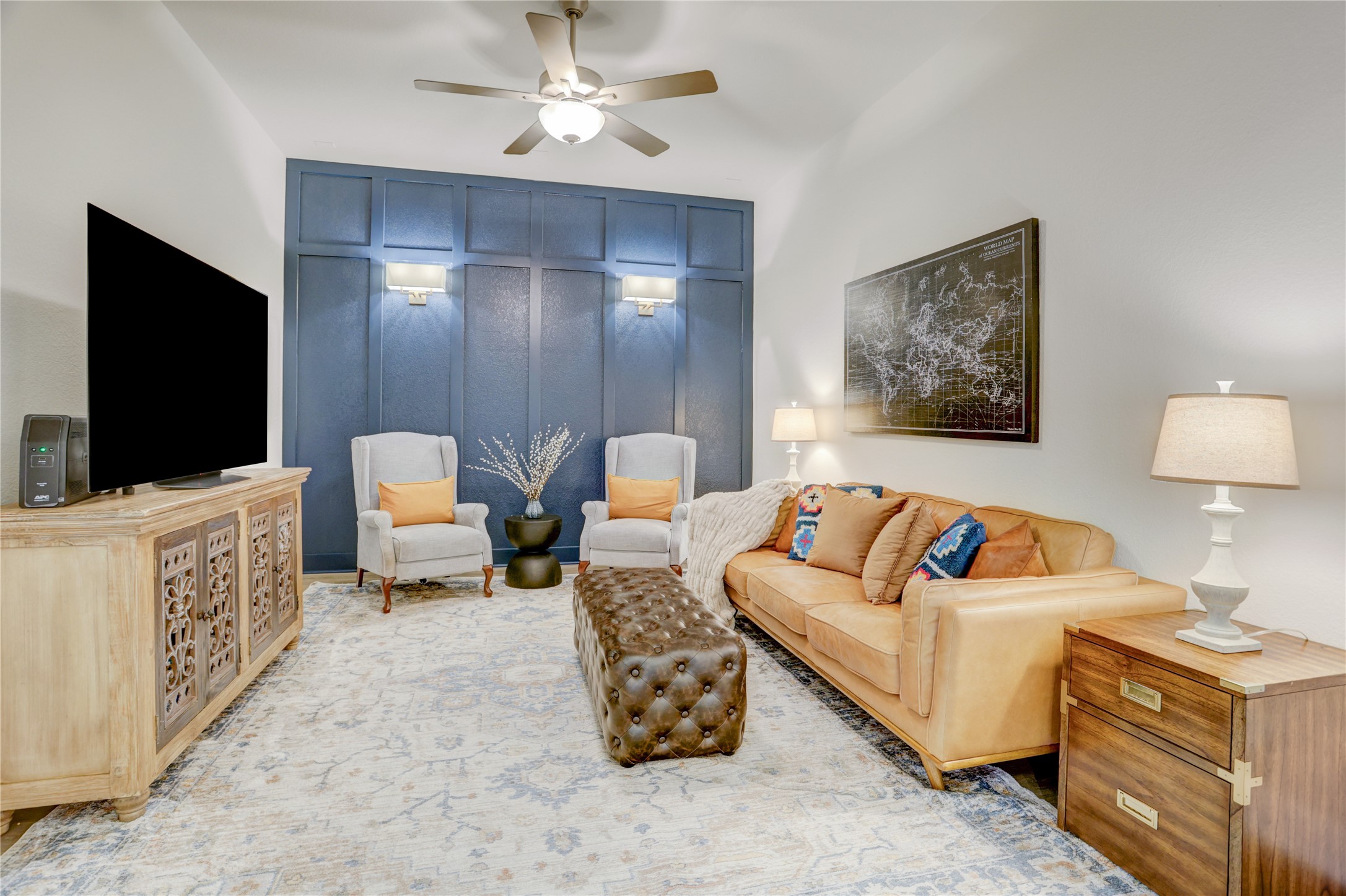 9818 Wright Drive Manvel, TX 77583 - Photo 5 of 32 a living room with furniture and a flat screen tv