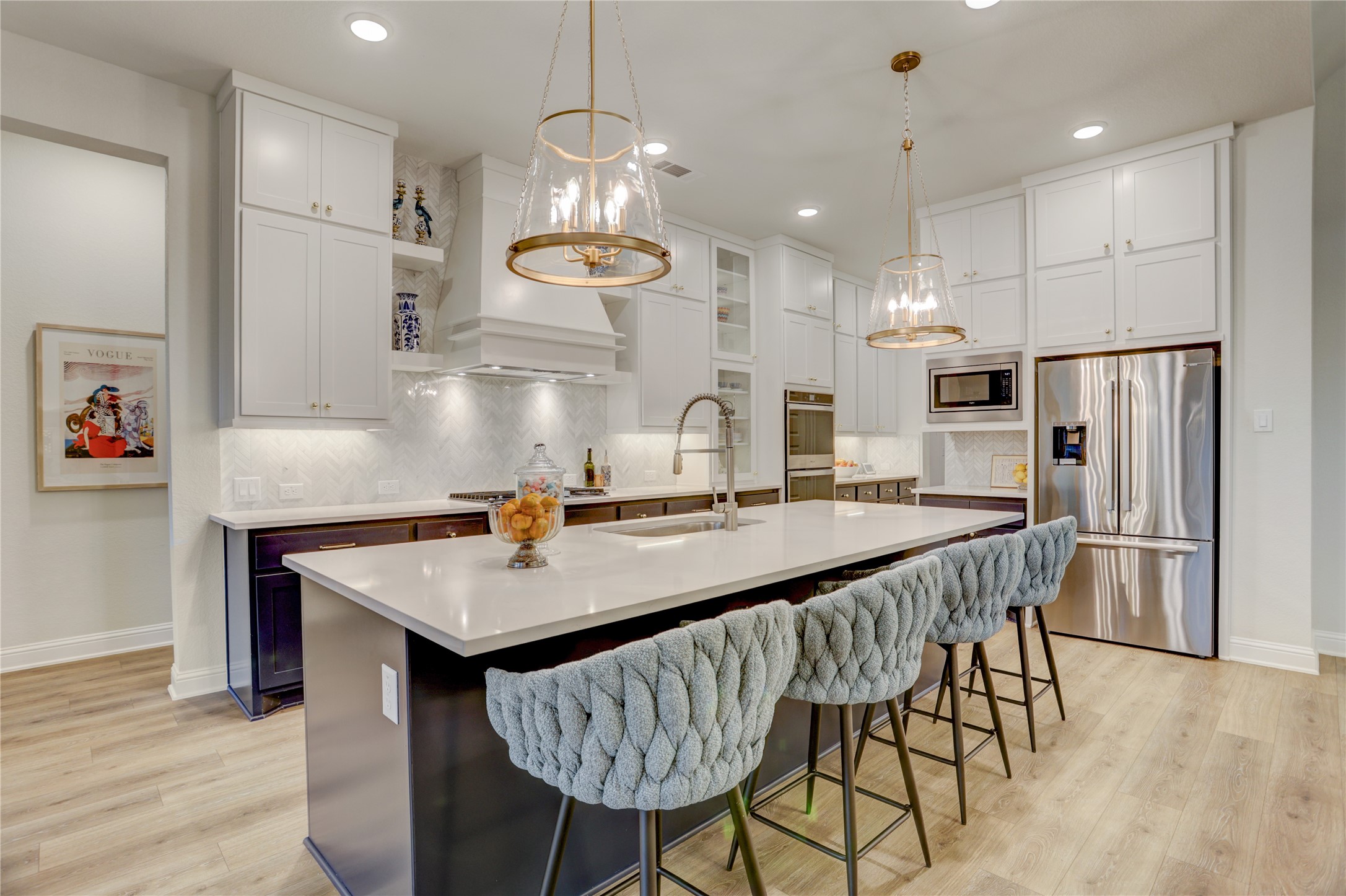 9818 Wright Drive Manvel, TX 77583 - Photo 10 of 32 a kitchen with stainless steel appliances granite countertop a kitchen island a stove a table and chairs