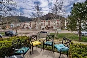 a view of a backyard with sitting area