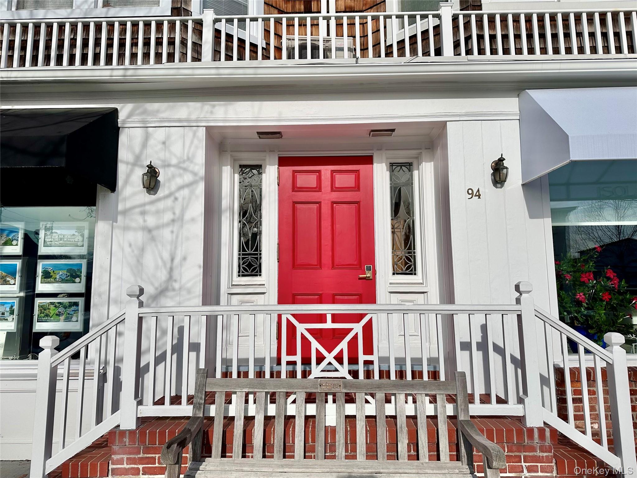 front view of a porch with a bench