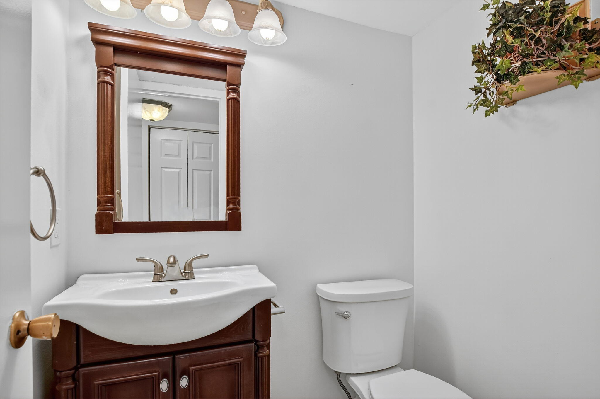 177 Fanshaw East, Unit 177 Boca Raton, FL 33434 - Photo 13 of 70 a bathroom with a toilet a sink and a mirror