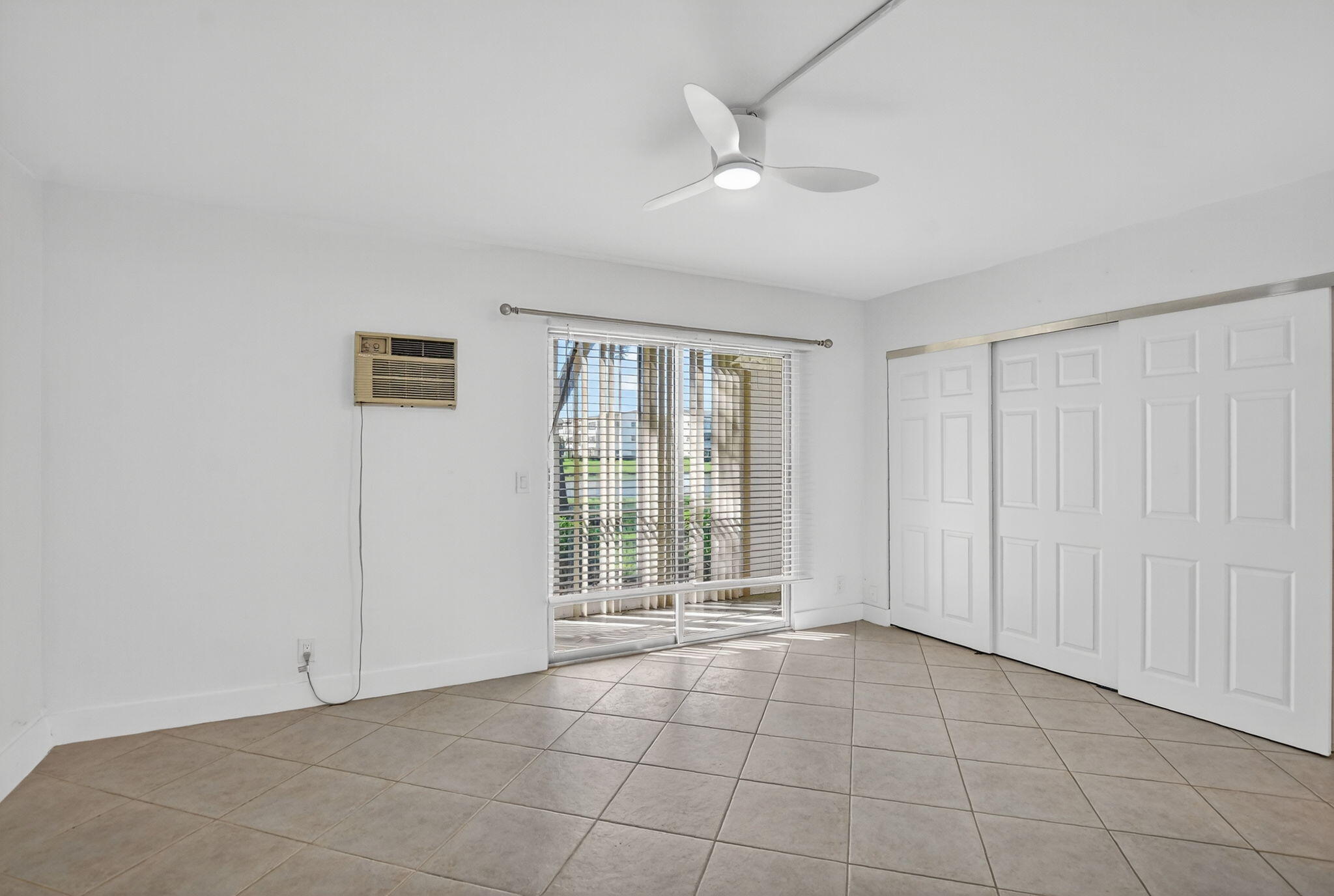 177 Fanshaw East, Unit 177 Boca Raton, FL 33434 - Photo 16 of 70 a view of an empty room with a window