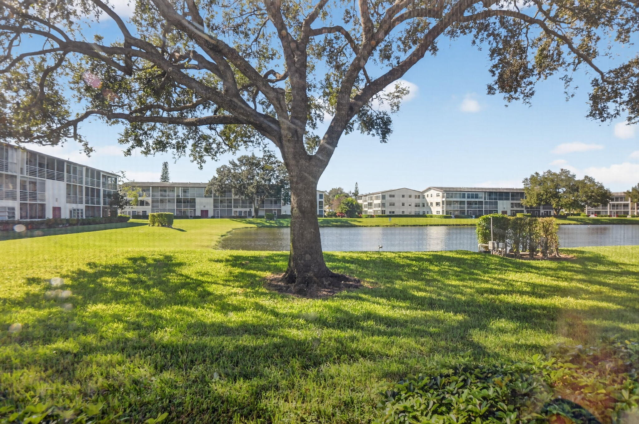 177 Fanshaw East, Unit 177 Boca Raton, FL 33434 - Photo 21 of 70 a swimming pool with outdoor seating and yard
