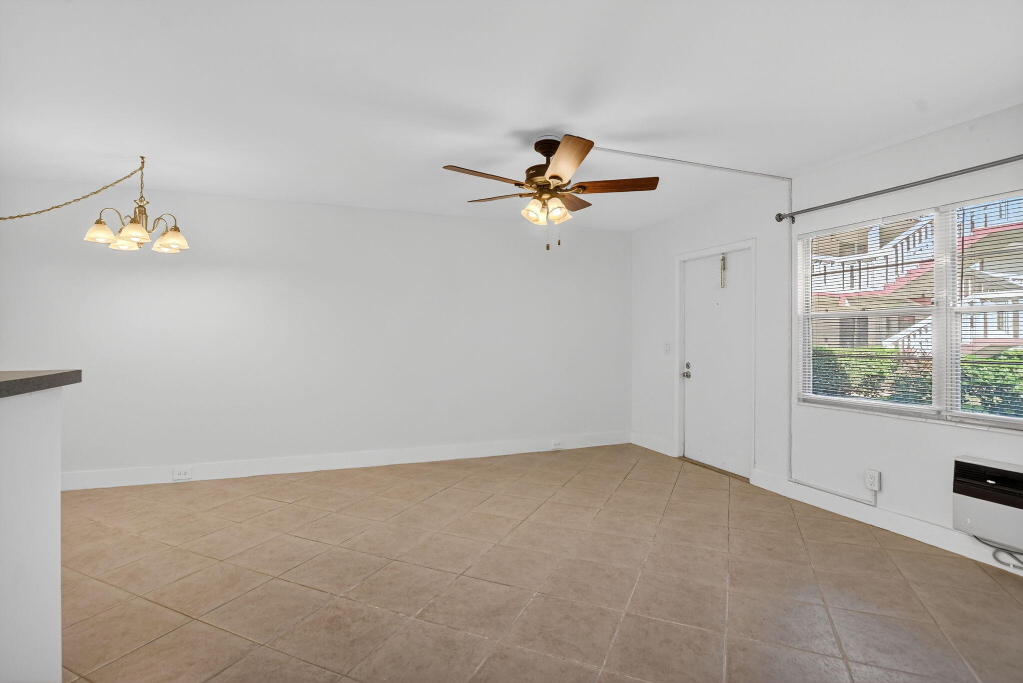 177 Fanshaw East, Unit 177 Boca Raton, FL 33434 - Photo 5 of 70 an empty room with a window