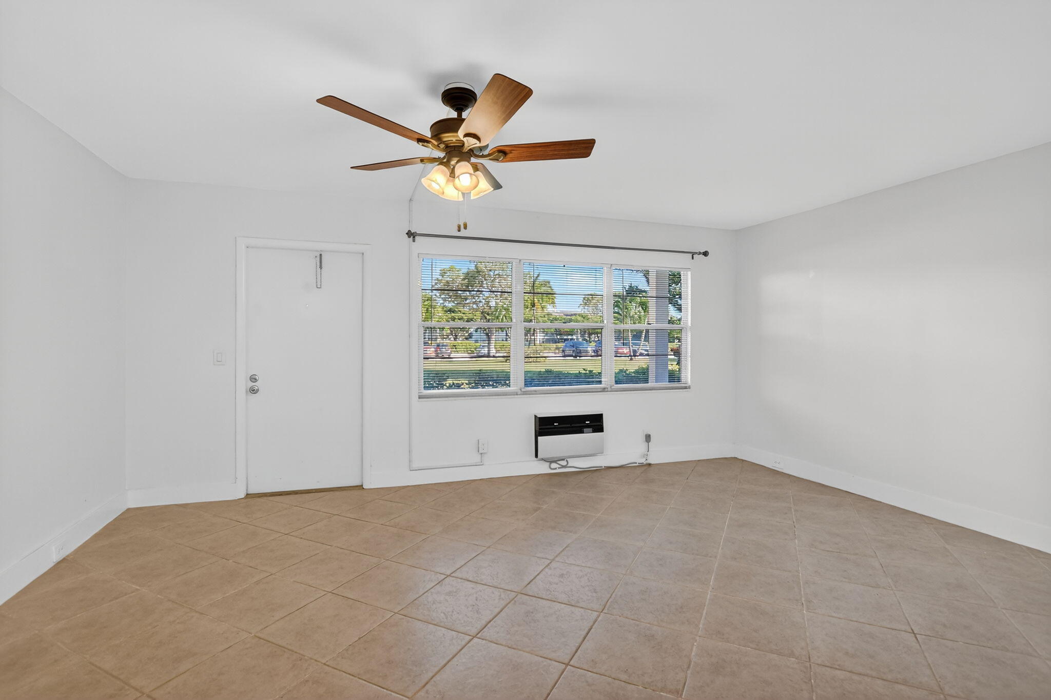 177 Fanshaw East, Unit 177 Boca Raton, FL 33434 - Photo 6 of 70 a view of an empty room with a window