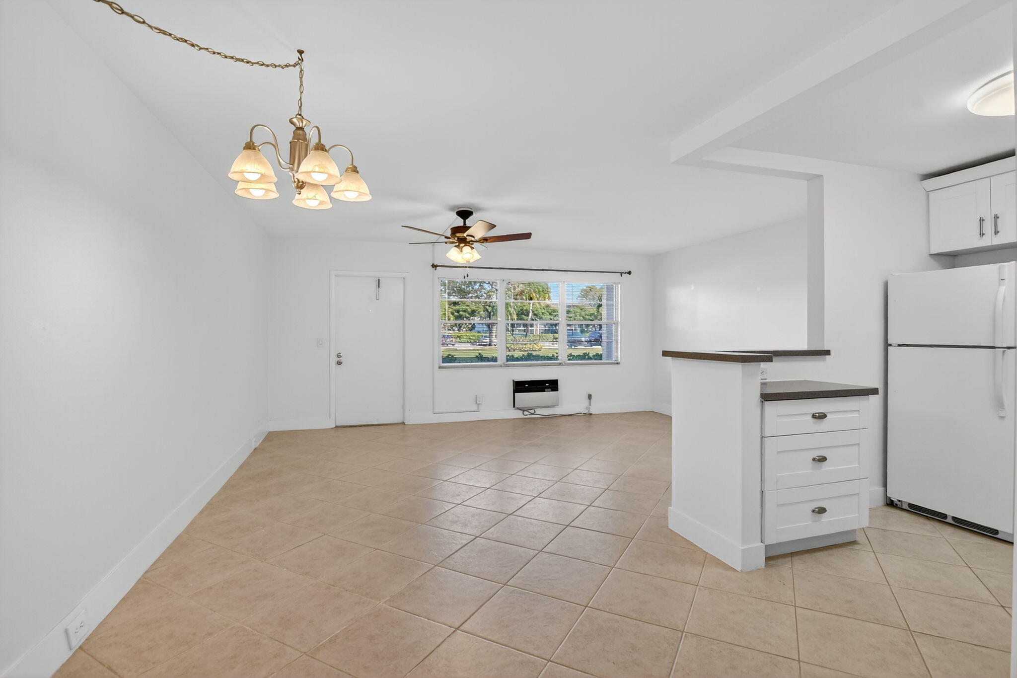 177 Fanshaw East, Unit 177 Boca Raton, FL 33434 - Photo 8 of 70 a view of a kitchen with dishwasher and a refrigerator