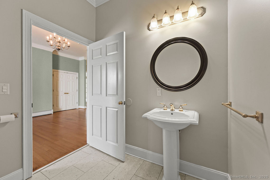 105 School Road Bolton, CT 06043 - Photo 16 of 39 a bathroom with a sink and a mirror