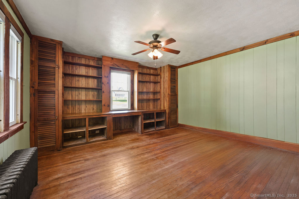 105 School Road Bolton, CT 06043 - Photo 18 of 39 wooden floor in an empty room with a window