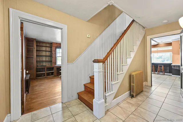 a view of a hallway with staircase